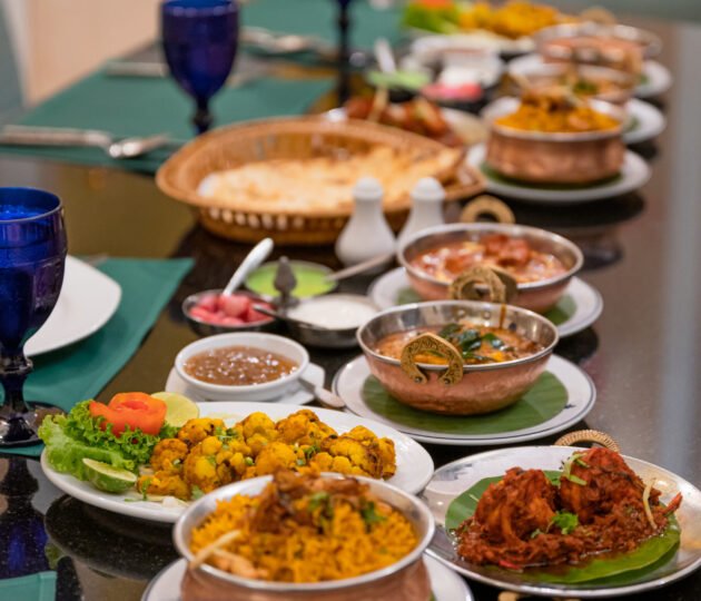 Various Indian food with meat, curry, soup and spicy taste on the table in restaurant